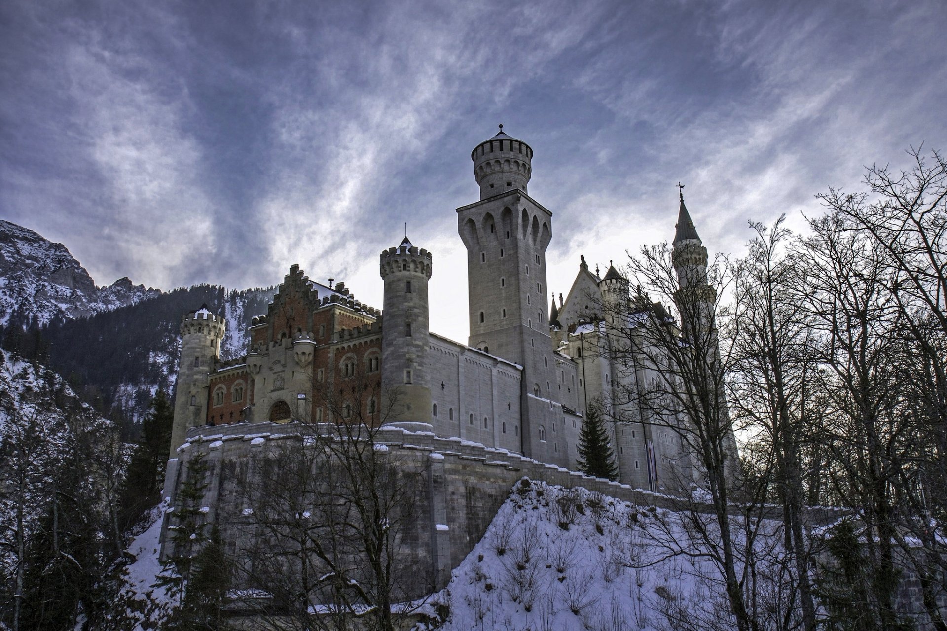 neuschwanstein castle bavaria germany mountains trees winter