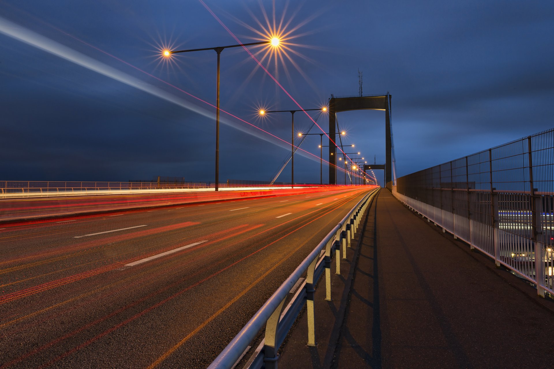 weden gothenburg town night road track bridge lamps lights traffic extract blue sky