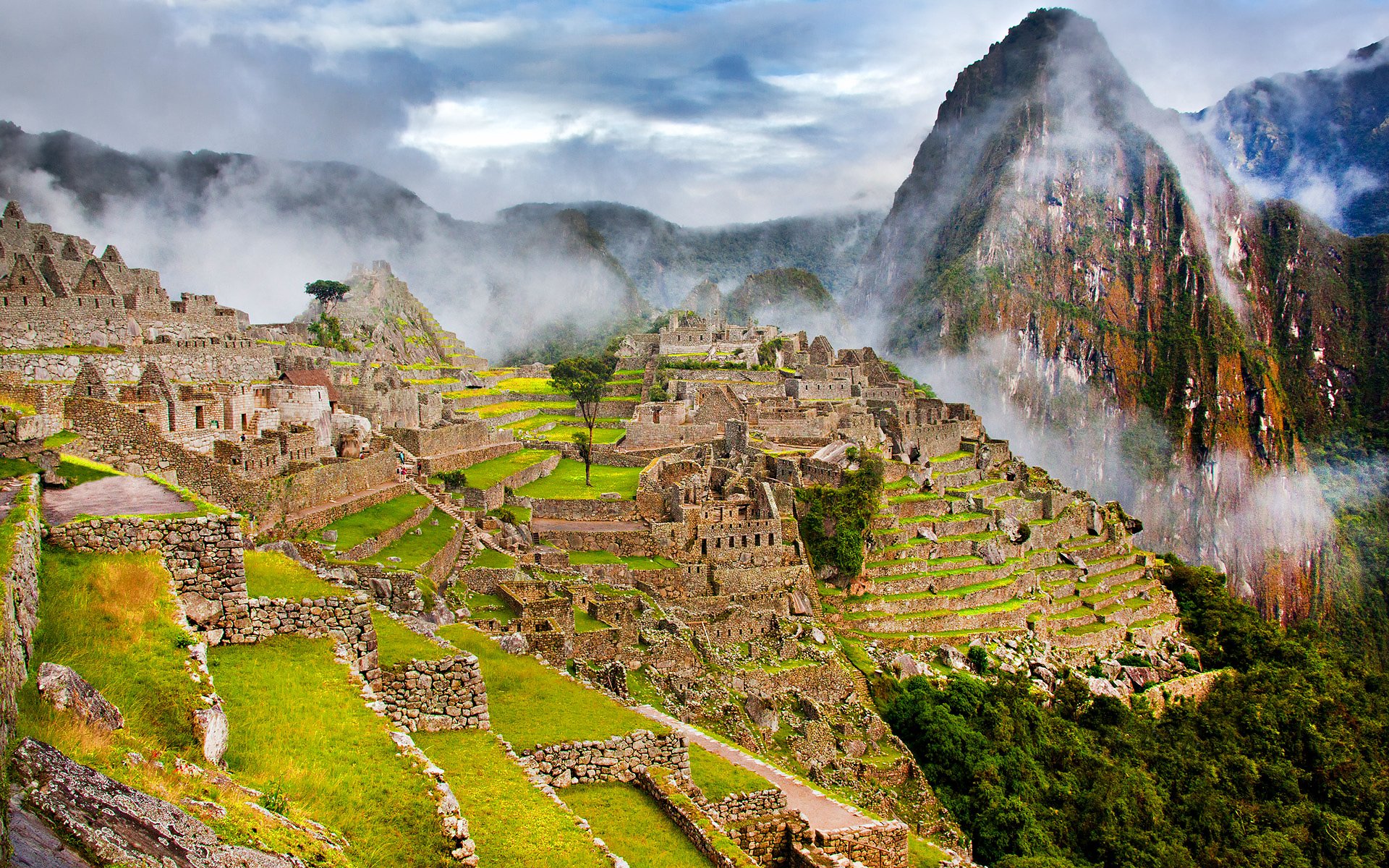 peru town machu picchu ruins mountain slopes fog