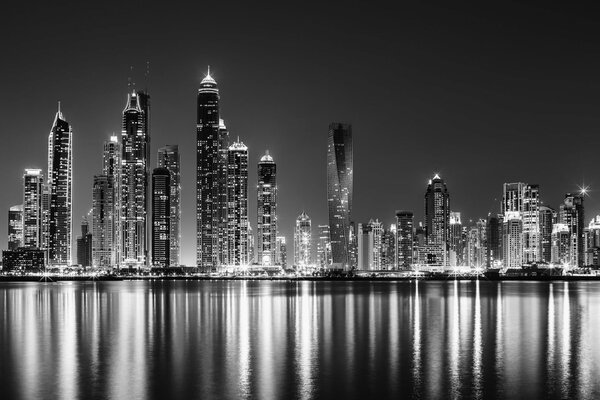 Black and white photo of Dubai from the ocean