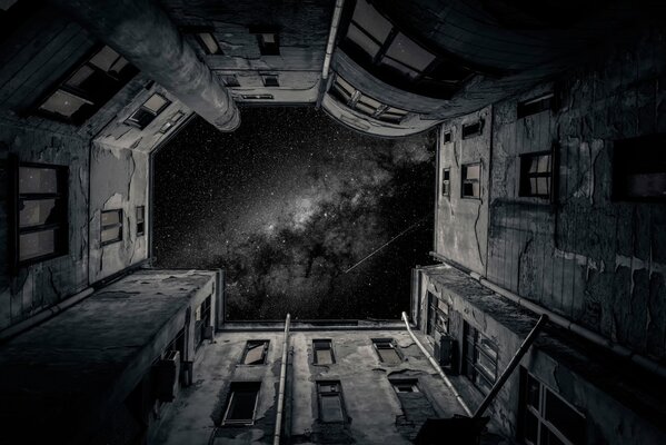 In a closed house, the night sky is visible