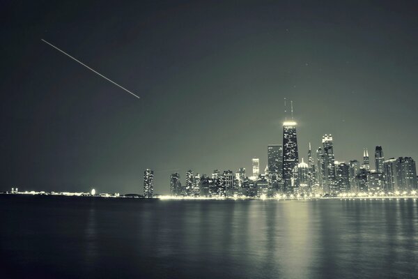 The night city across the river. Skyscrapers