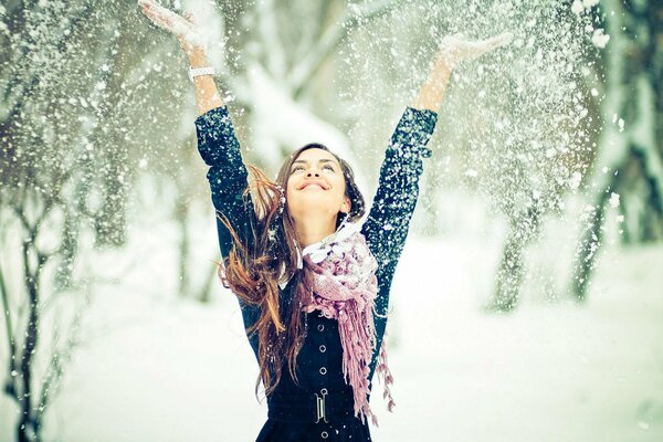 Funny girl in the winter forest