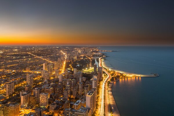 Ocean, megapolis high-rise buildings evening