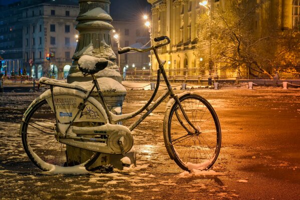 Bicycle on a snow-covered Bucharest street