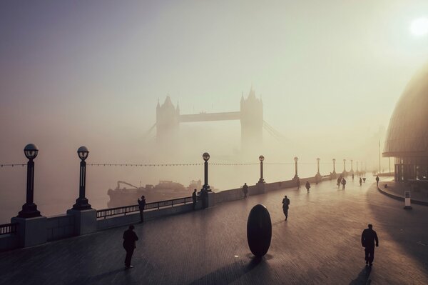 Foggy bridge over the river in London