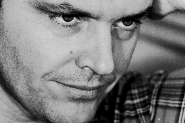 Young Jack Nicholson in black and white filter and plaid shirt