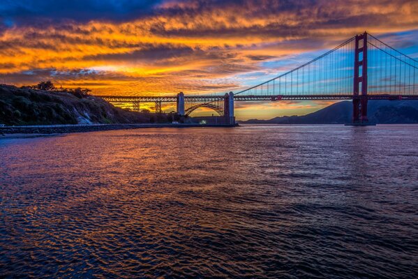 Golden Gate Bridge across the Strait at sunset