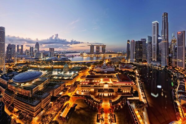 Photo from a height. Singapore. Evening Singapore, house lights