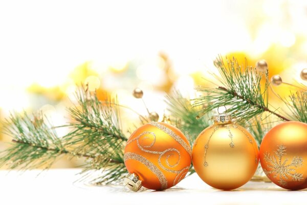 Golden Christmas tree toys on a blurry background