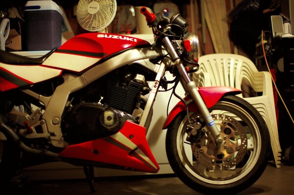 Motorcycle with red trim in the garage