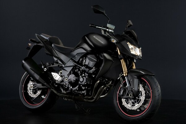 Black motorcycle on a dark background