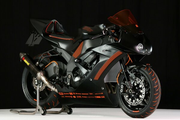 Black motorcycle with orange inserts