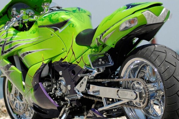 Green motorcycle with big tires