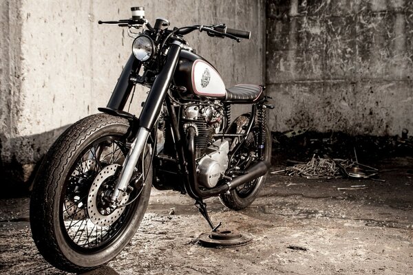 Black motorcycle on a gray background