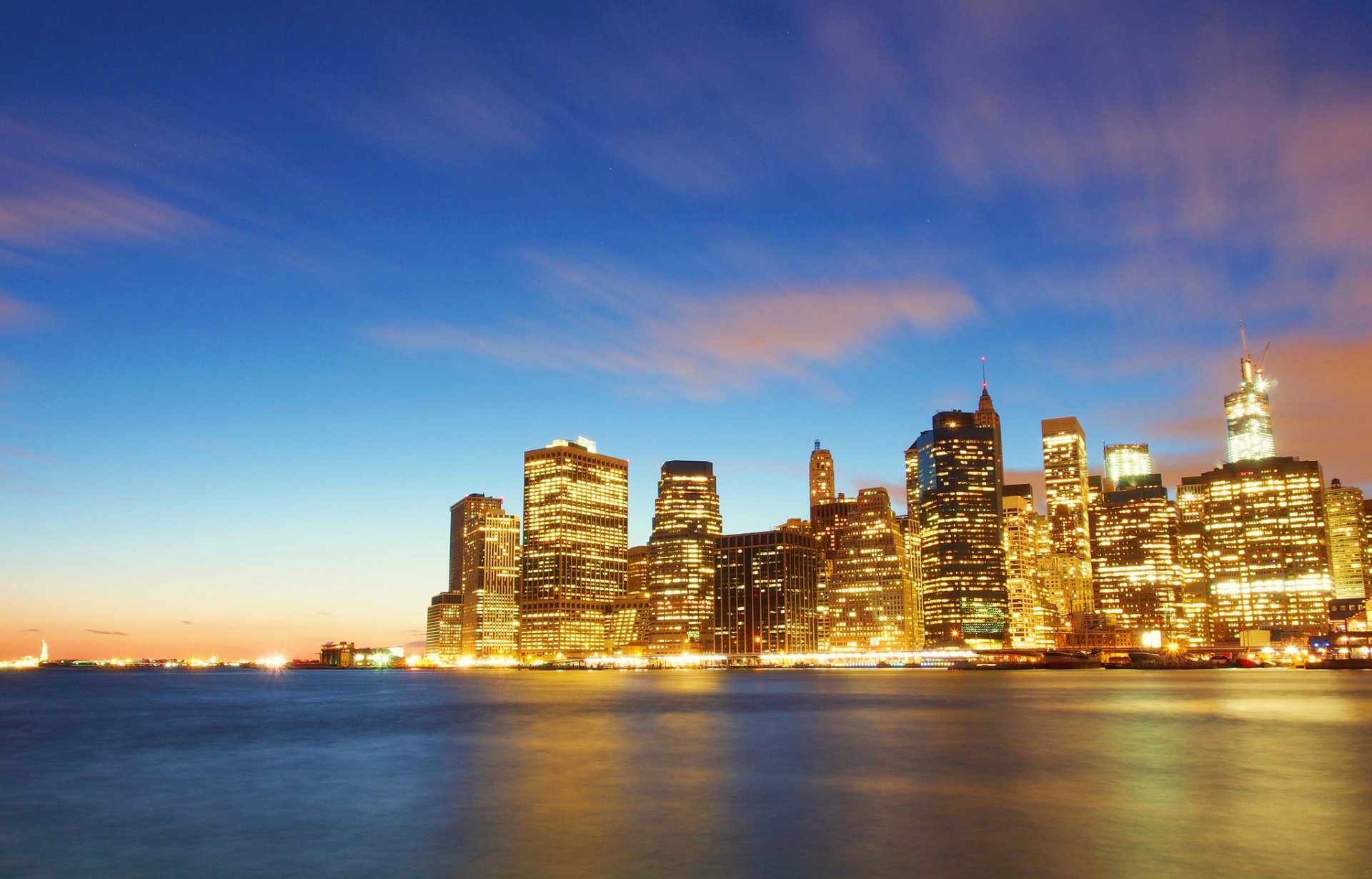 new york manhattan wall street financial district usa east river city evening lights river skyscrapers skyscrapers buildings house