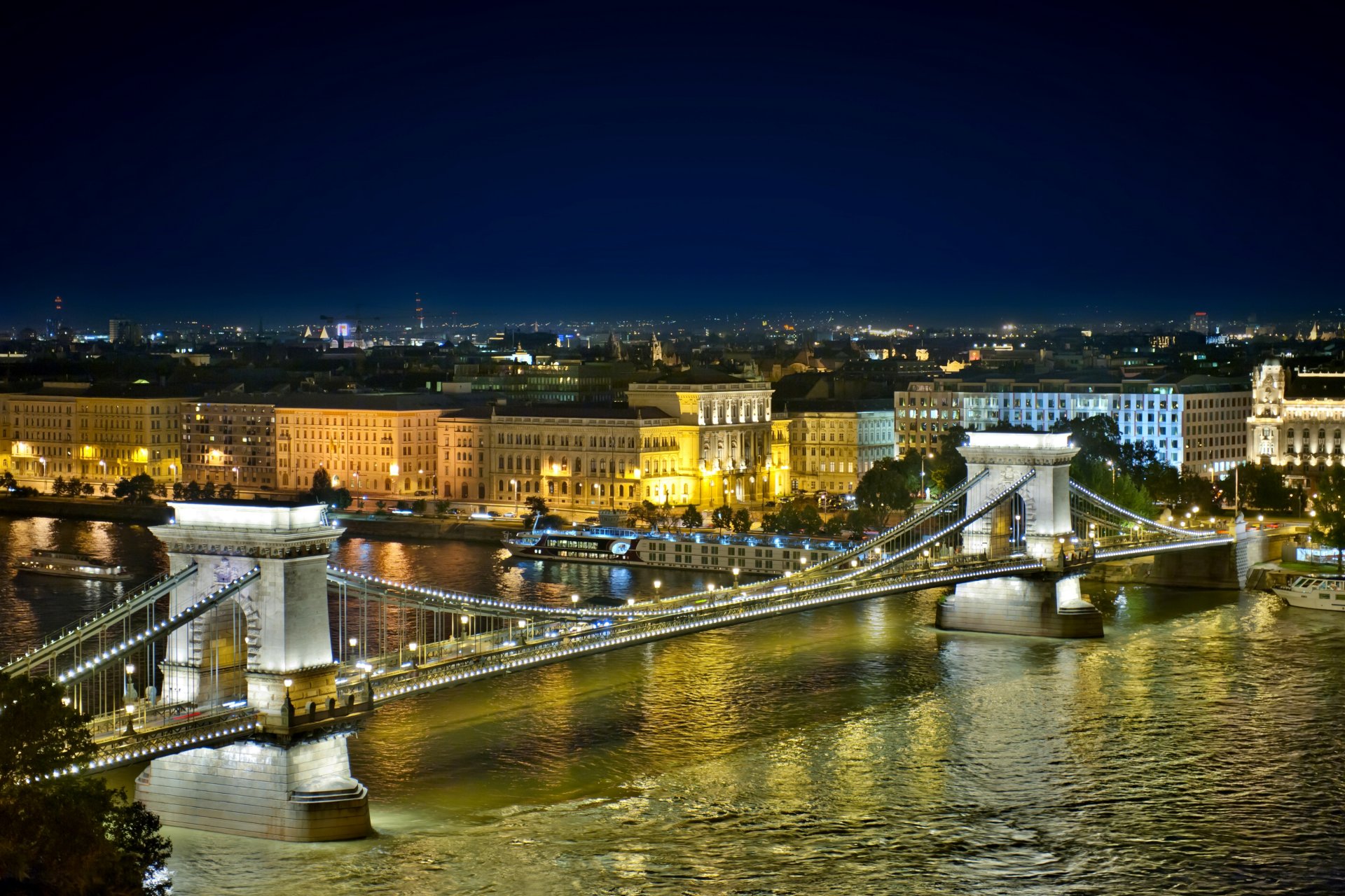 budapest hungary chain bridge river danube town night house building