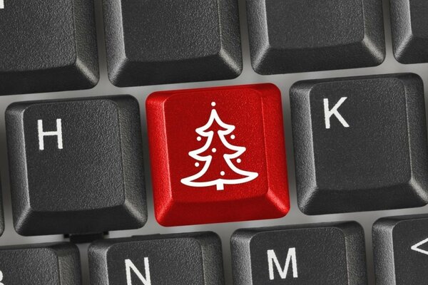 Rote Taste-ein Weihnachtsbaum auf einer Computertastatur