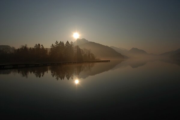 A misty surface enveloped the lake