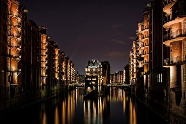 Reflection of the night castle on the water