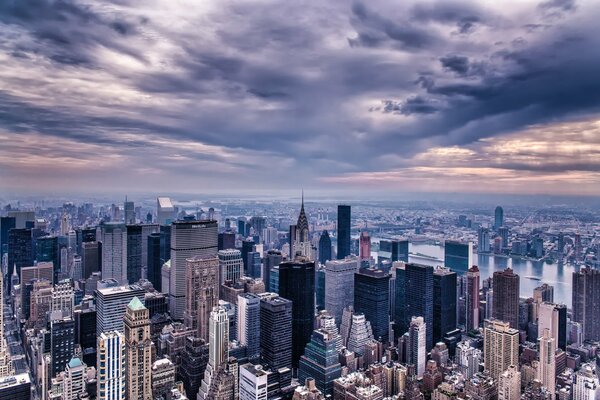 A big city in the darkness of clouds