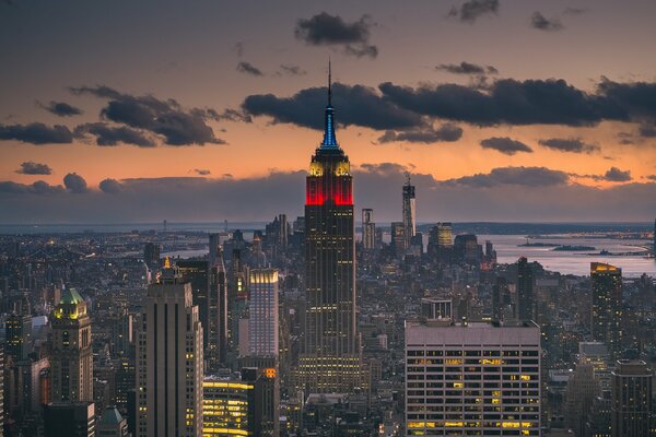 A skyscraper in the evening city on a huge island