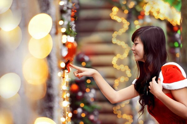 Charming Asian woman on holiday in a red dress