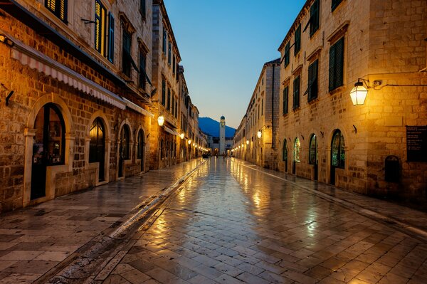 An old evening street lit by lights