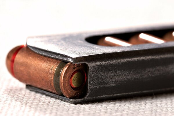 Macro photo of cartridges in the pistol store