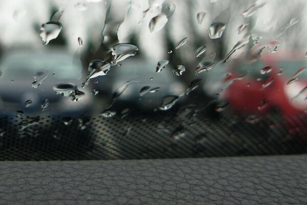 Raindrops on the car window , transparent drops