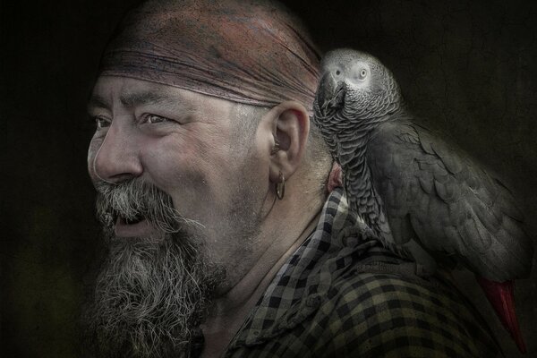 An old pirate with a parrot on his shoulder