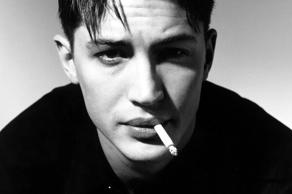 Young Tom Hardy with a cigarette