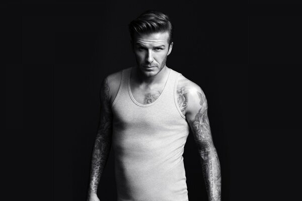 Athlete David Beckham, engaged in football