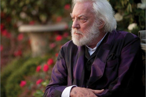A shot from the movie The Hunger Games . Donald Sutherland as President Snow.