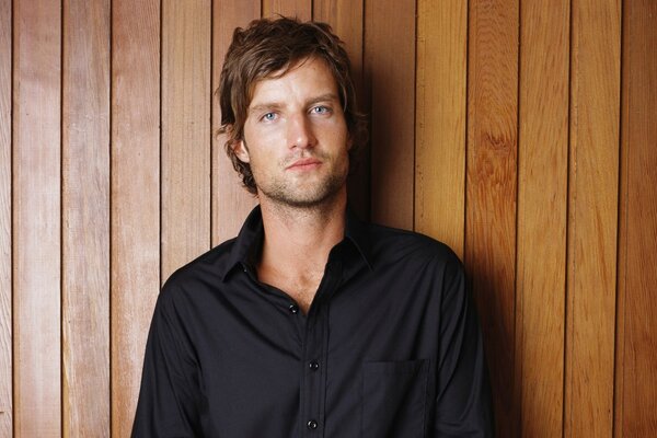 A cute blue-eyed man in a black shirt