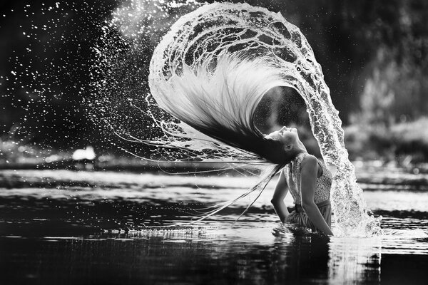 Girl waving her hair water