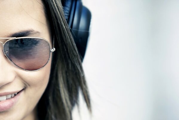 Brunette face with glasses and headphones