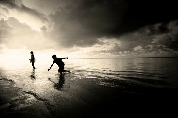 Retro photo of children running in shallow water