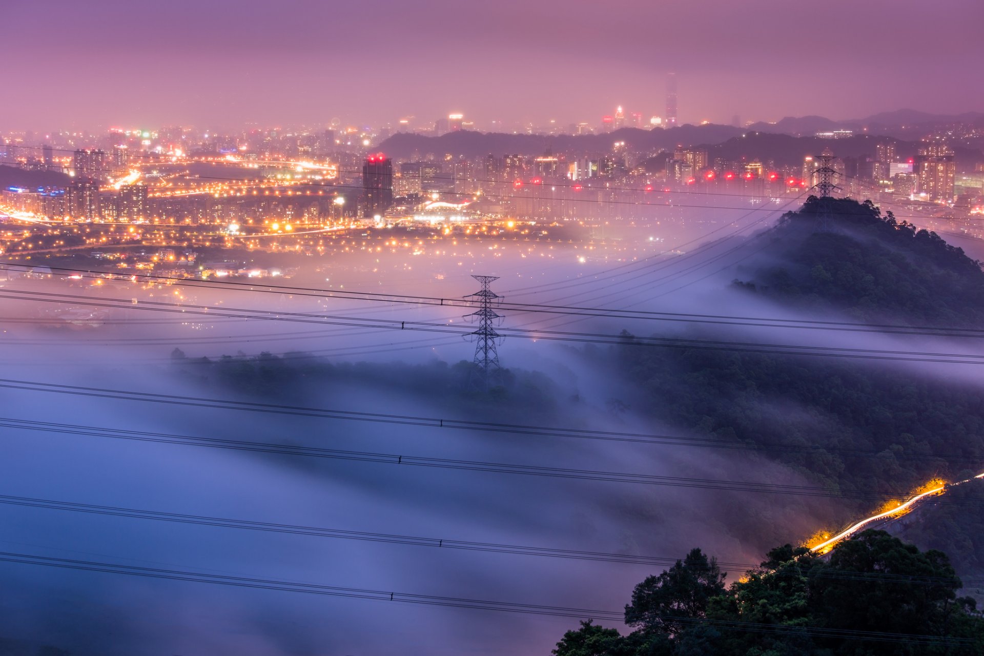 china prc taiwan taipei city lilac sky fog haze lights lighting trees hills supports wires view height panorama