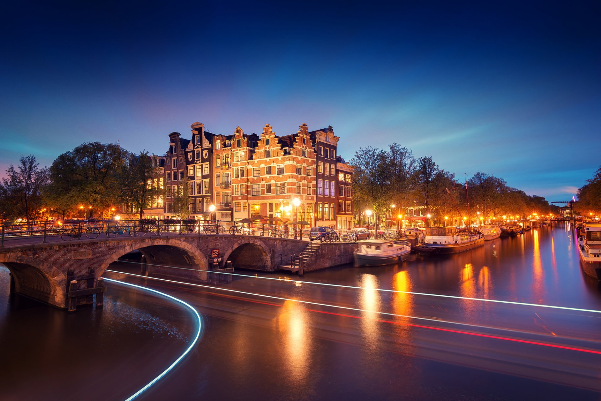 amsterdam north holland netherlands holland city evening bridge canal lights exposure light lighting lanterns river boats tree