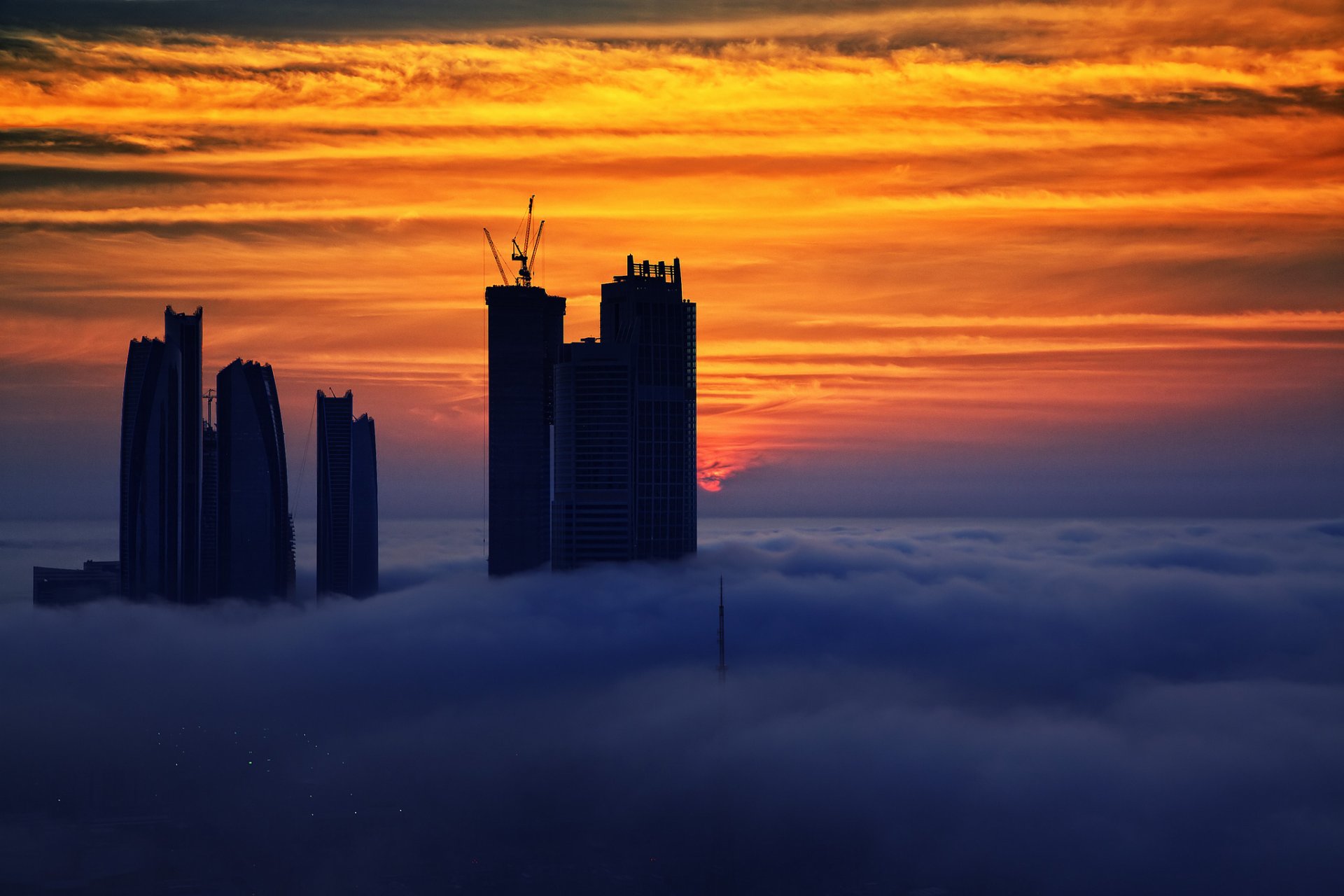 emirats arabes unis eau abu dhabi ciel maisons coucher de soleil nuages brouillard photos filippo