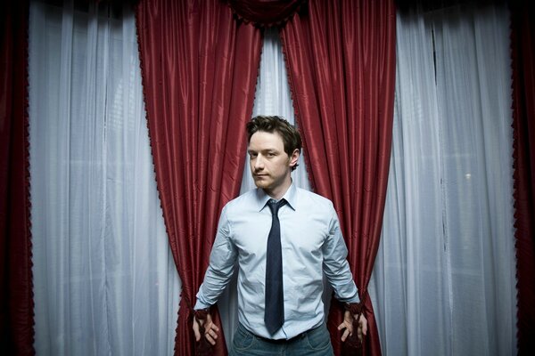 Actor McAvoy in red curtains