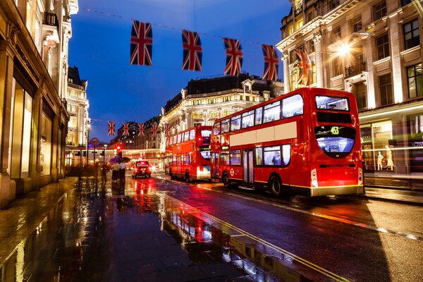 Famous London buses on the evening street