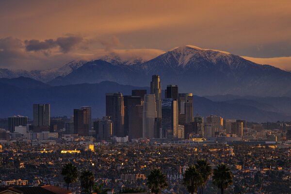 Sunrise in the city at the foot of the mountains