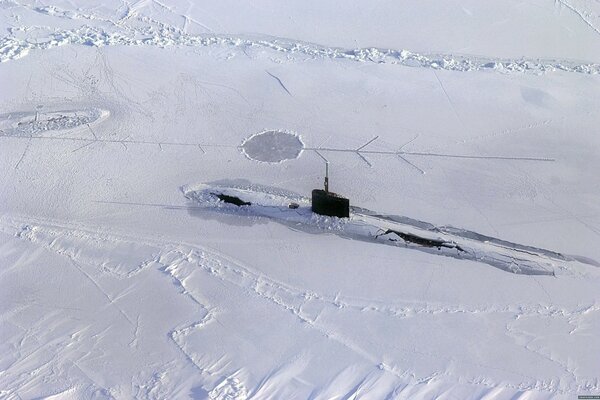 Submarine emerges from under the Arctic ice