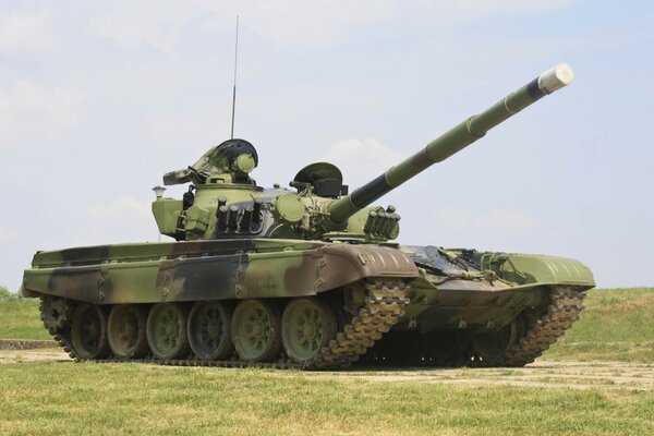 Tank in khaki colors on the field