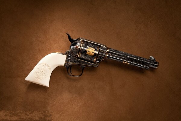 An old revolver with a beautiful handle