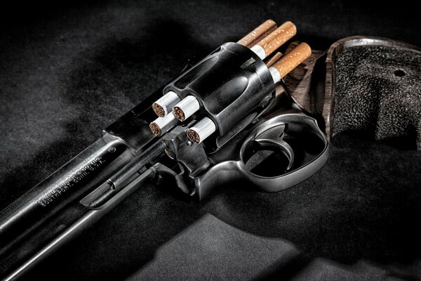 The gun is loaded with cigarettes instead of bullets