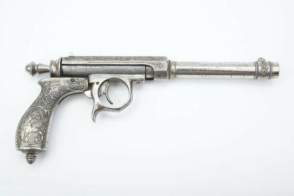 Image of an old gray pistol