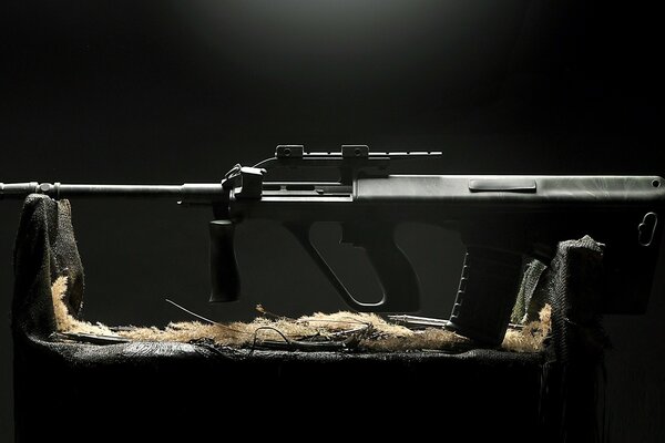 Image of a black rifle on a black background